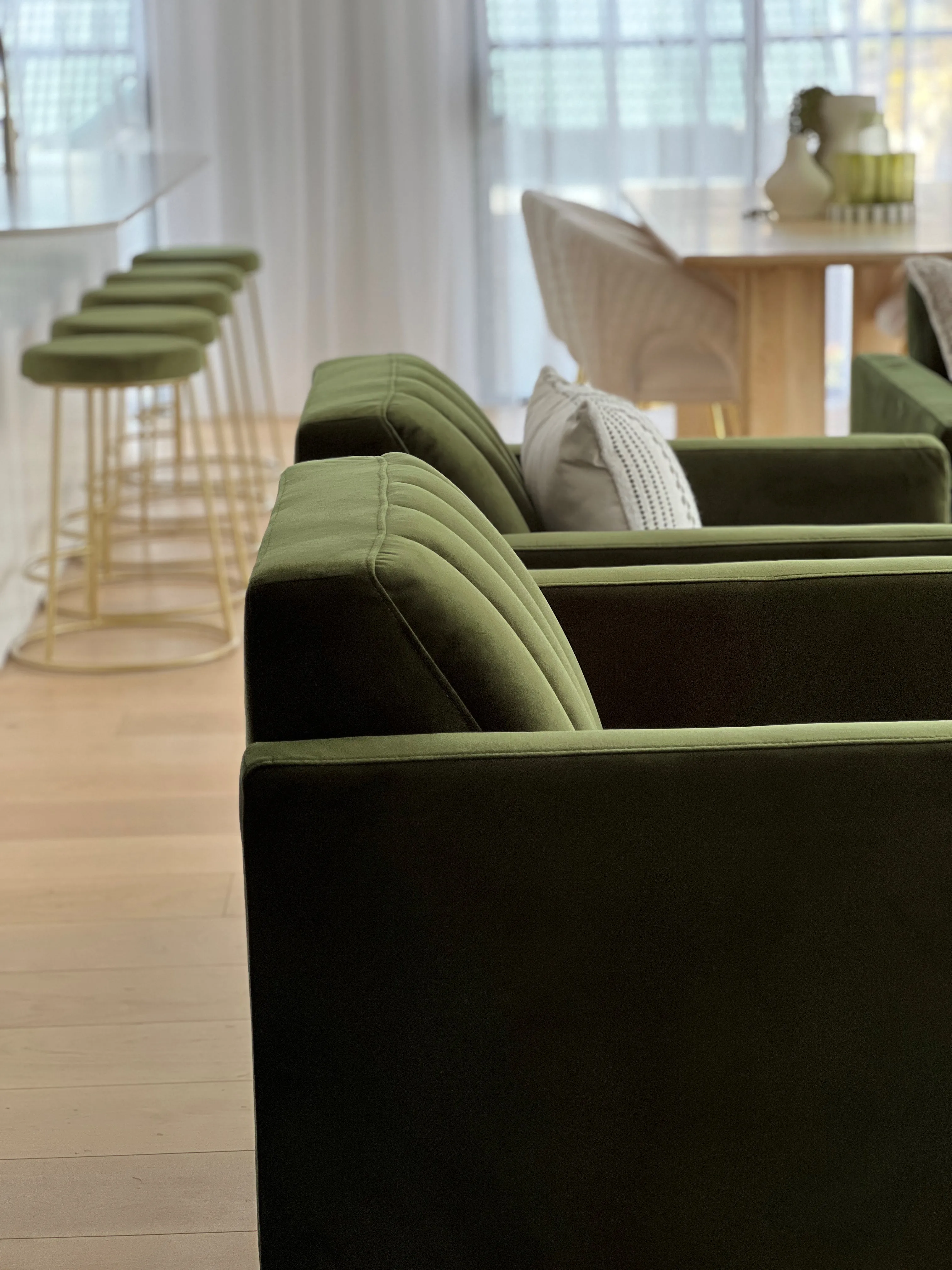 Open-plan living area with coastal styling and natural light